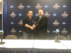Receiving the National Wrestling Media Association’s 2017 Division I SID Of The Year Award from NWMA President Jason Bryant.